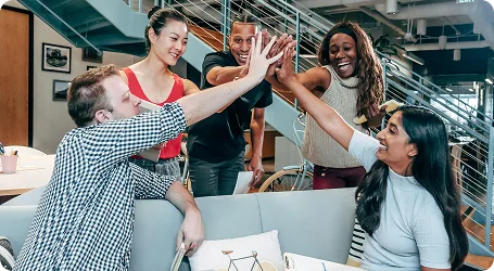 A team celebrating a release with a high five